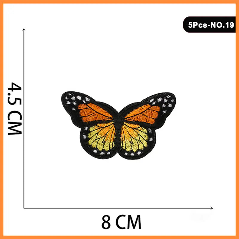 A set of five embroidered iron-on patches featuring orange and black butterfly designs.