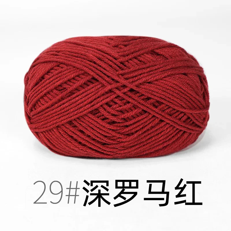 A ball of deep red, tightly twisted knitting yarn for crafts.