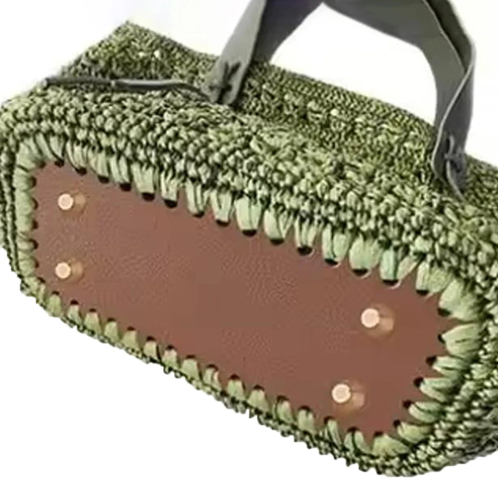 A square woven bag with a brown lining and green textured exterior, featuring hanging hooks.
