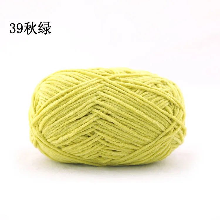 A ball of light yellow chenille yarn used for knitting and crochet projects.