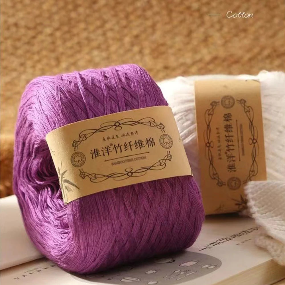 Purple yarn skein labeled Bamboo Fiber Cotton for crafting