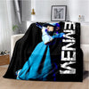 A black and white graphic throw blanket featuring a woman in a blue outfit with purple hair.