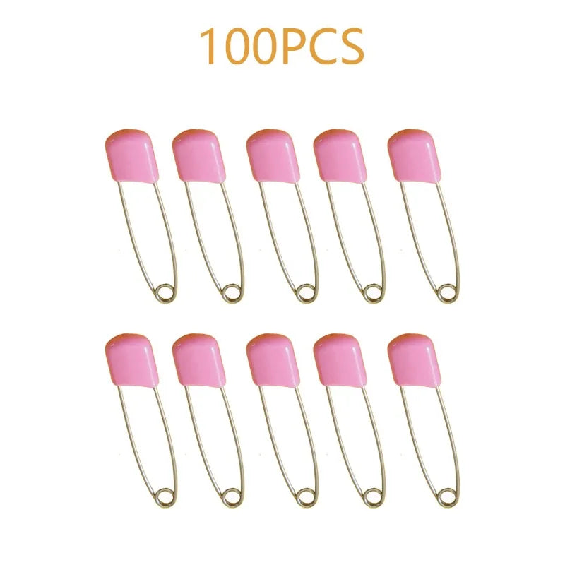 A collection of 100 pink stainless steel diaper pins with safety locking closures.