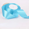 Roll of light blue satin craft ribbon with a white center core