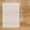 A rectangular silicone crafting mat with dimensions 30cm by 40cm resting on a wooden surface.