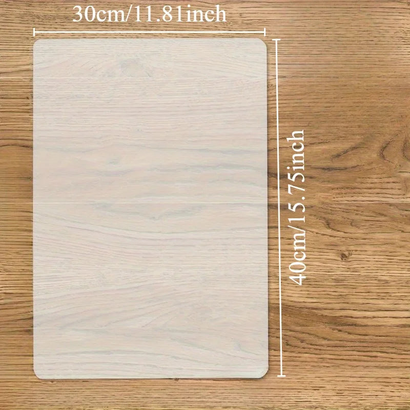 A rectangular silicone crafting mat with dimensions 30cm by 40cm resting on a wooden surface.