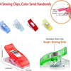 A set of four sewing clips in various colors, including blue, green, red, and yellow, demonstrating a strong grip.