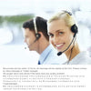 A smiling woman wearing a headset is looking at the camera, with a blurred man in the background.