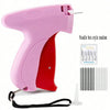 A pink micro stitching gun with a red body and a needle box style random set of needles.