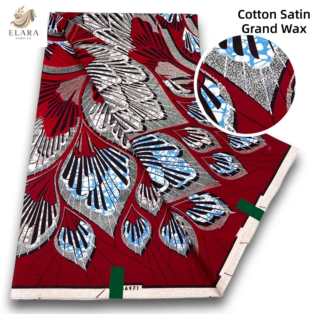 Red cotton satin grand wax print fabric featuring intricate silver and blue patterns