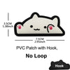 A white cat face PVC patch with a hook on the bottom edge.