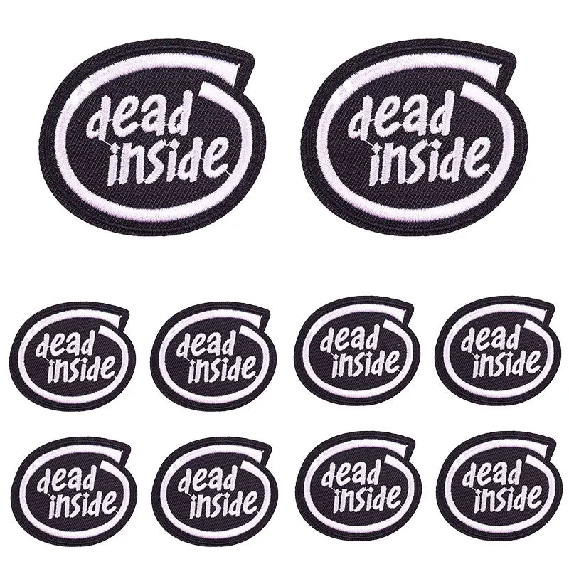 A set of black embroidered patches featuring the text dead inside in white lettering.