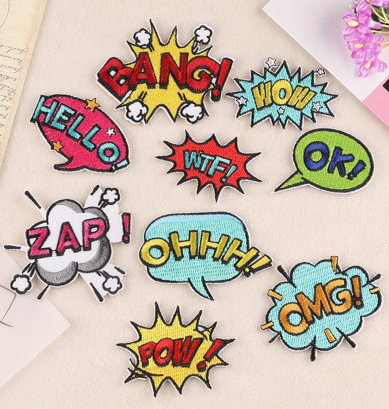 A collection of colorful lettering embroidery patches featuring words like BANG HOW WTF OK ZAP OHH OMG and POW