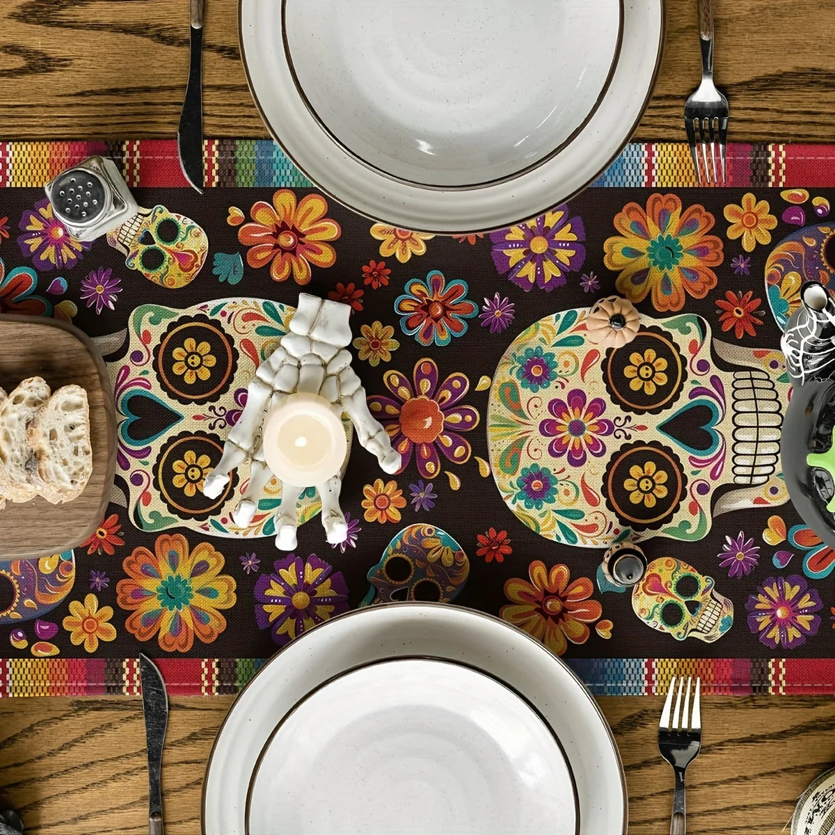 A colorful table runner featuring skulls and floral patterns for a Day of the Dead theme.
