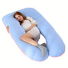 A woman is resting her head on a large, light blue U-shaped memory foam pillow.
