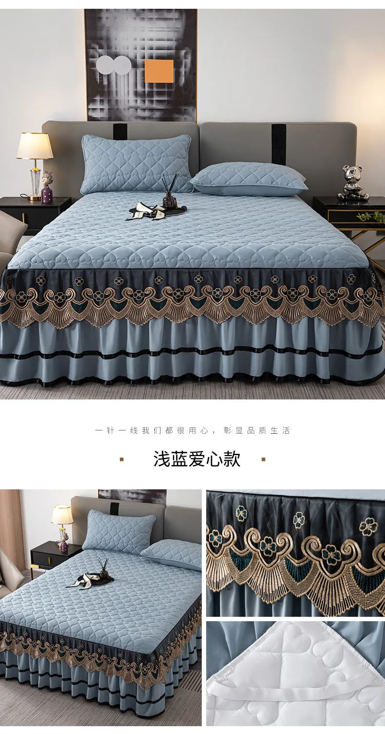 Light blue quilted bed skirt with gold embroidery and a white quilted cover visible in close-up shots.