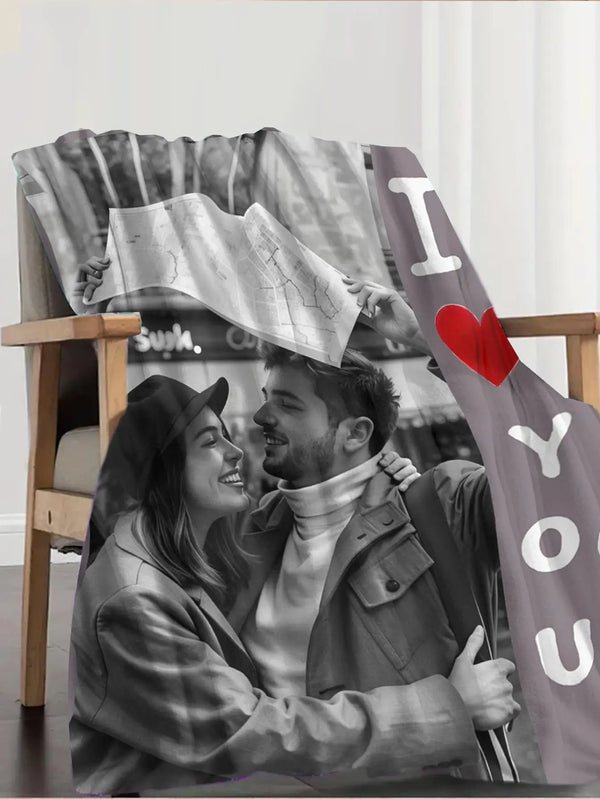 A couple smiling while holding a map, featured on a custom photo personalized flannel blanket.