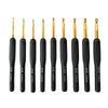 A set of ergonomic gold crochet hooks with various sizes and grips displayed vertically.