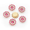 A collection of pink and clear rhinestone crystals set in flower-shaped clusters.