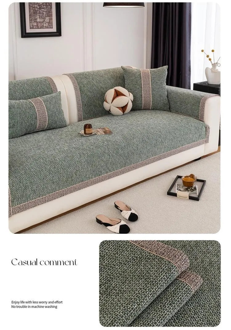 A gray sofa cushion cover with a textured fabric and decorative piping, shown on a light-colored sofa.