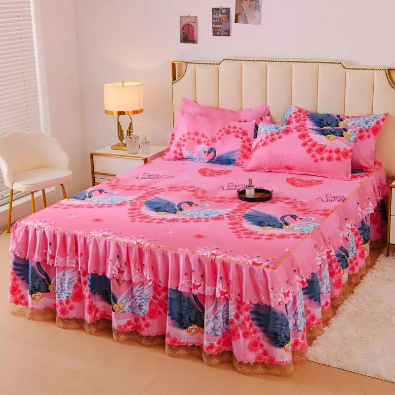 Pink floral bed skirt with blue and purple birds decorating a pink bed.