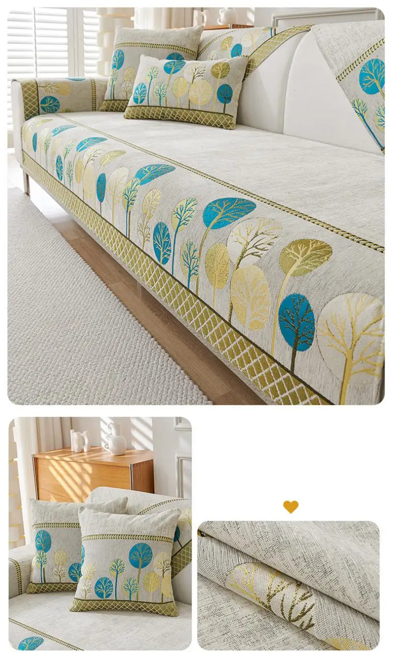 A light beige jacquard sofa seat and back cover featuring a botanical pattern of blue, yellow, and green leaves.