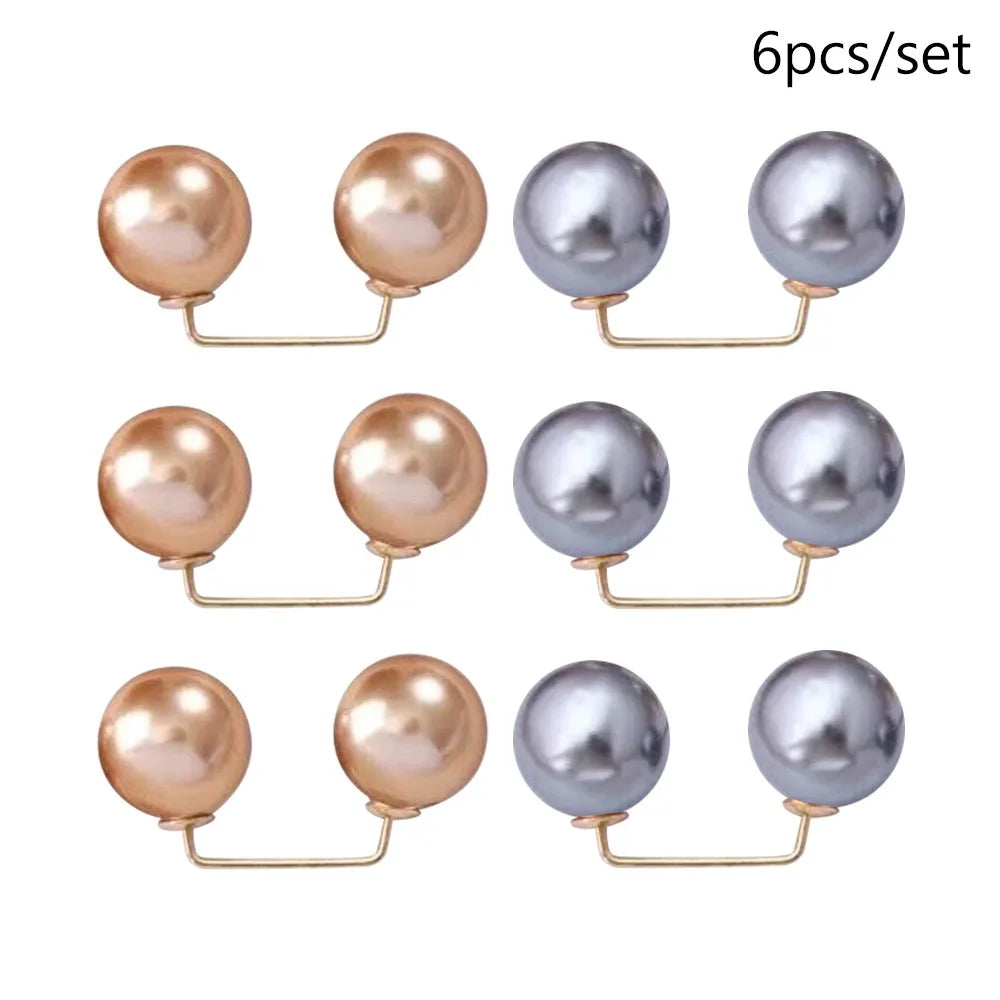 A set of six silver and rose gold pearl-shaped brooch jewelry pieces.