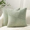 A light sage green textured corduroy throw pillow cover with vertical ribbing.