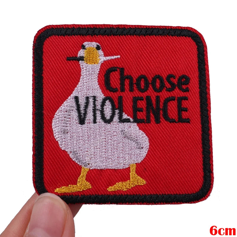 Red embroidered patch featuring a white cartoon goose with the text Choose Violence.