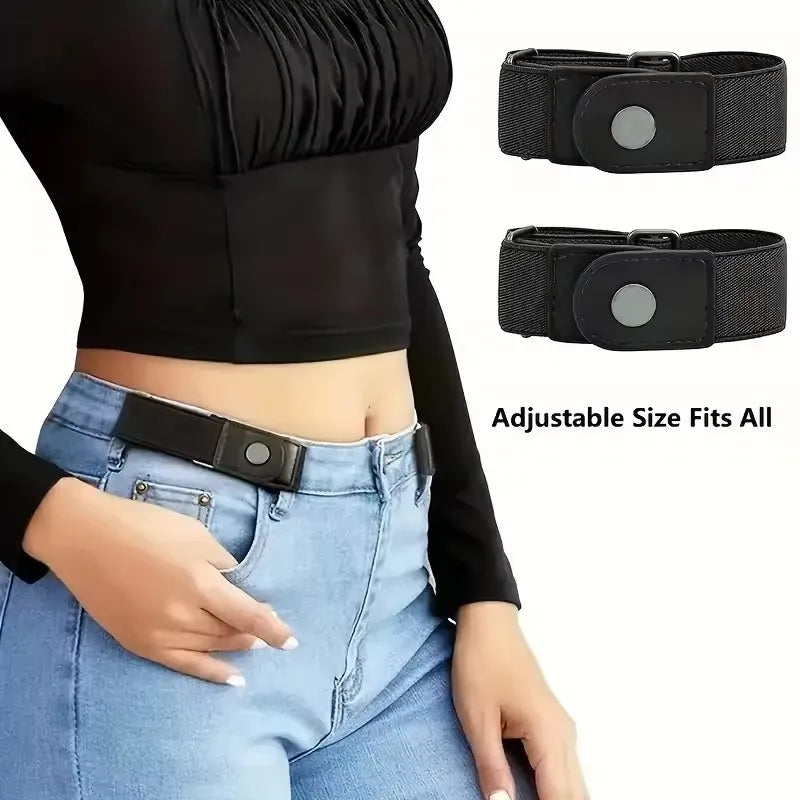 Black adjustable elastic belt with silver buckle shown on a woman's waist over blue jeans.