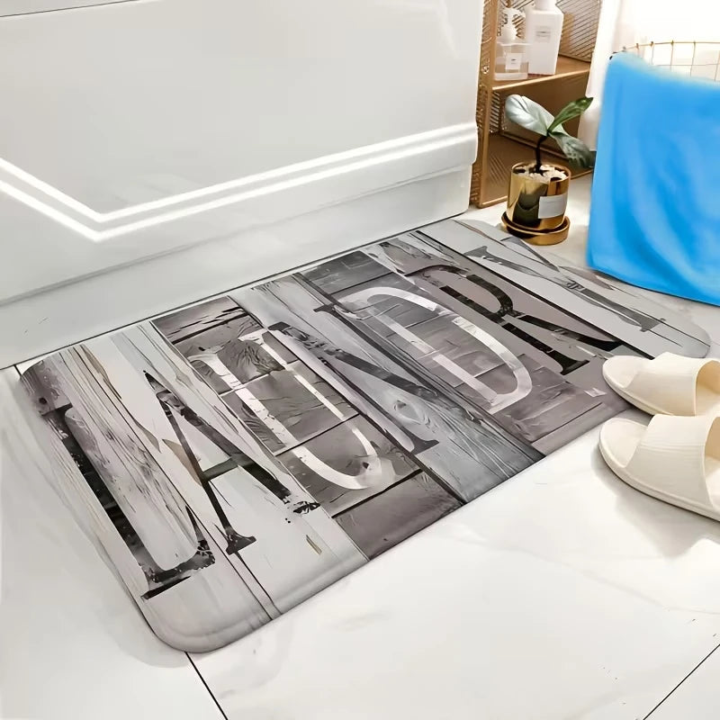 A rectangular indoor rug with a gray and white wood grain print placed on a white floor.