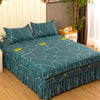 A teal fitted bed sheet set with three pillows and elastic lace trim displayed on a wooden bed frame.