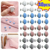 A set of adjustable quilt and fabric clips in various shades of pink, gray, and blue.