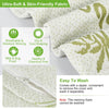 A close-up of a memory foam pillow with a breathable fabric cover showing features like mite proofing and easy washing.