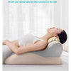A person is relaxing on a beige ergonomic memory foam wedge pillow designed for neck and shoulder support.