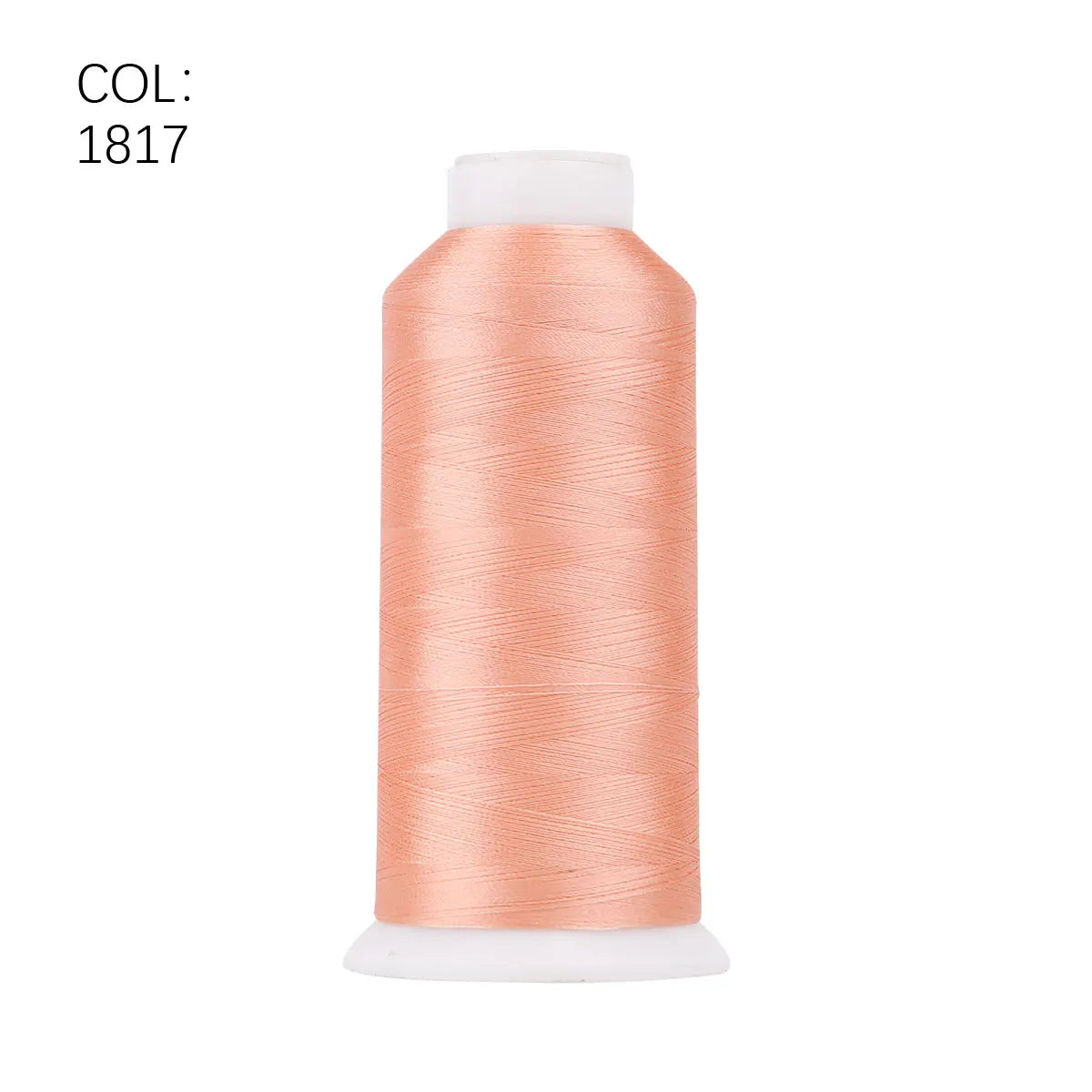 A roll of peach-colored polyester embroidery thread with a white core.