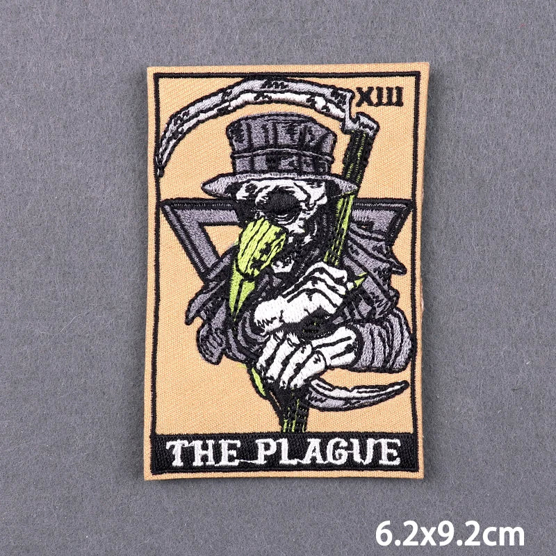 A black and white embroidery patch depicting a skull wearing a top hat and holding a pickaxe, with the text THE PLAGUE below 