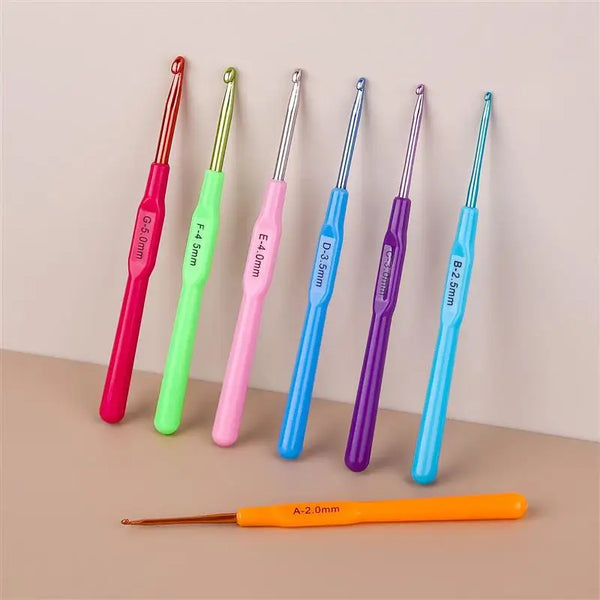 A collection of various precision aluminum alloy knitting and crochet hooks in different colors and sizes.