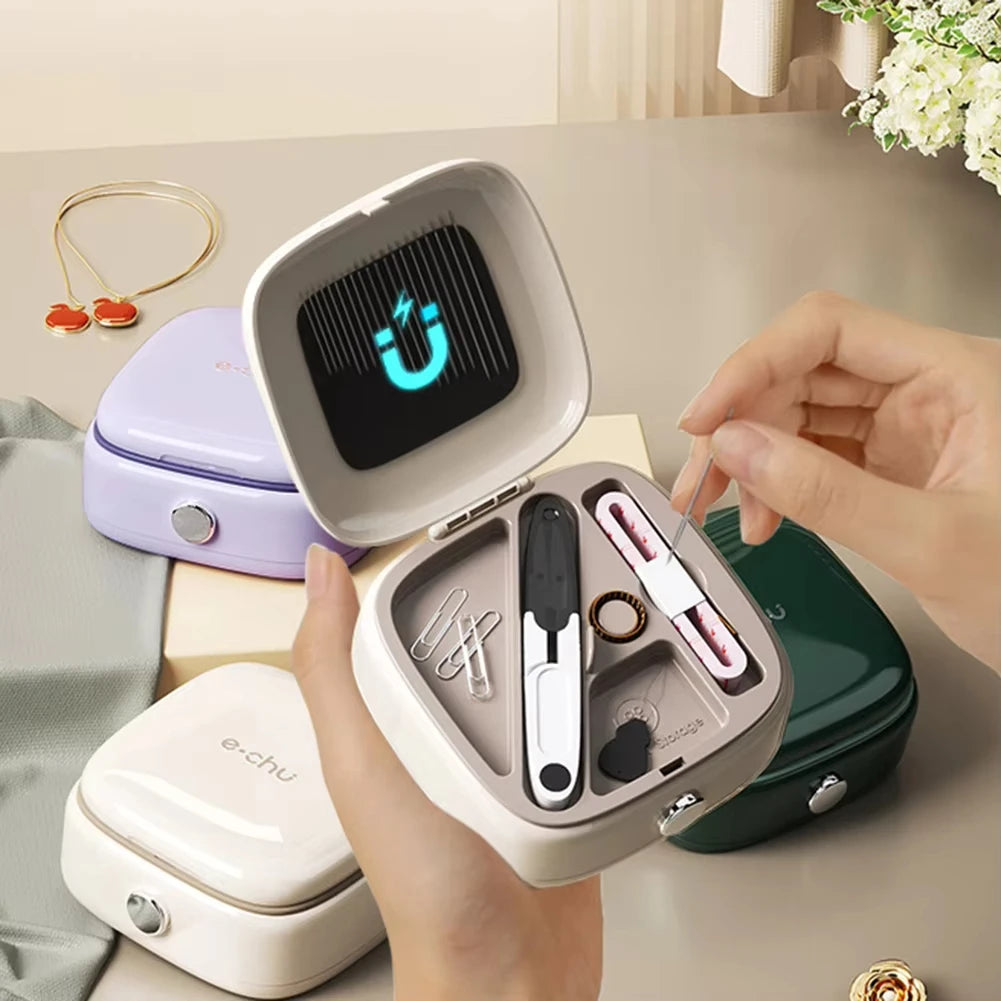 A hand holds an open magnetic sewing kit with specialty needles and thread, showing various tools and a purple charging case.