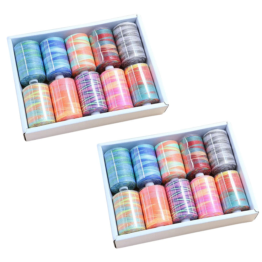 A box containing ten colors of bulk rainbow sewing thread spools arranged in rows.