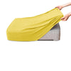 A yellow polar fleece jacquard sofa seat cushion cover being held by a hand.