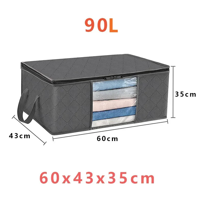 A black foldable storage box with a clear window showing several folded textiles.