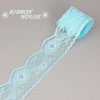 Light blue decorative lace ribbon roll with a delicate floral pattern.