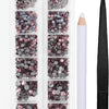 A clear plastic case containing various shades of pink and gray crystal rhinestones and an applicator tool for crafting