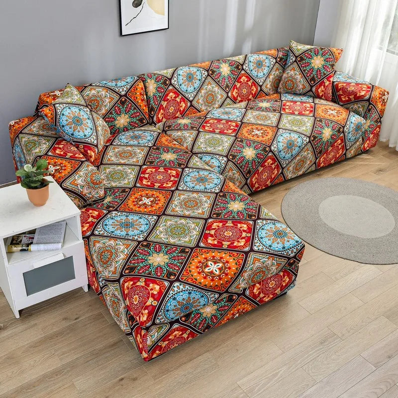 A colorful patterned sofa protector cover featuring geometric designs in red, orange, blue, and green tones.