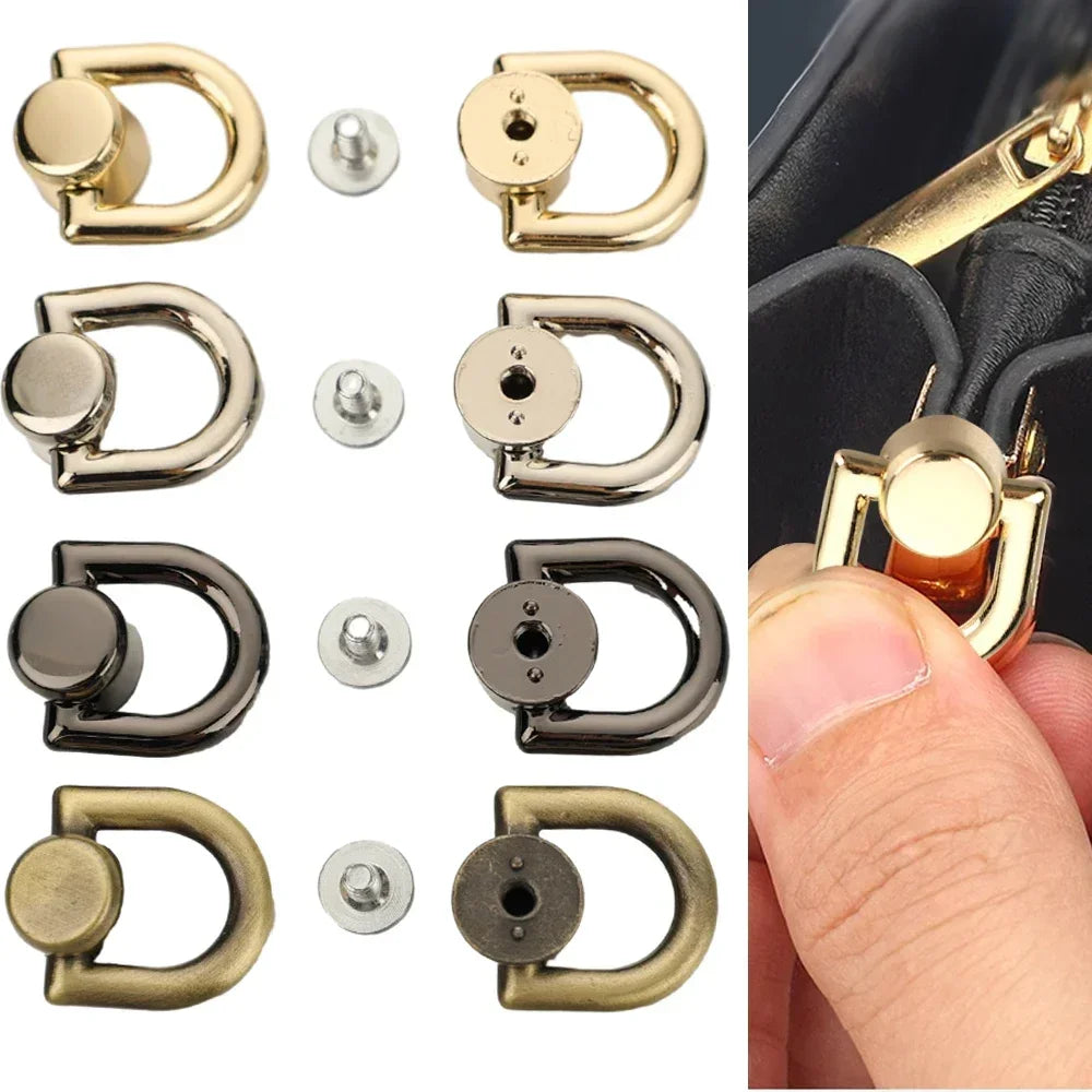 A collection of metal D-shaped ring bag handles in gold, silver, and black finishes with screw attachments.