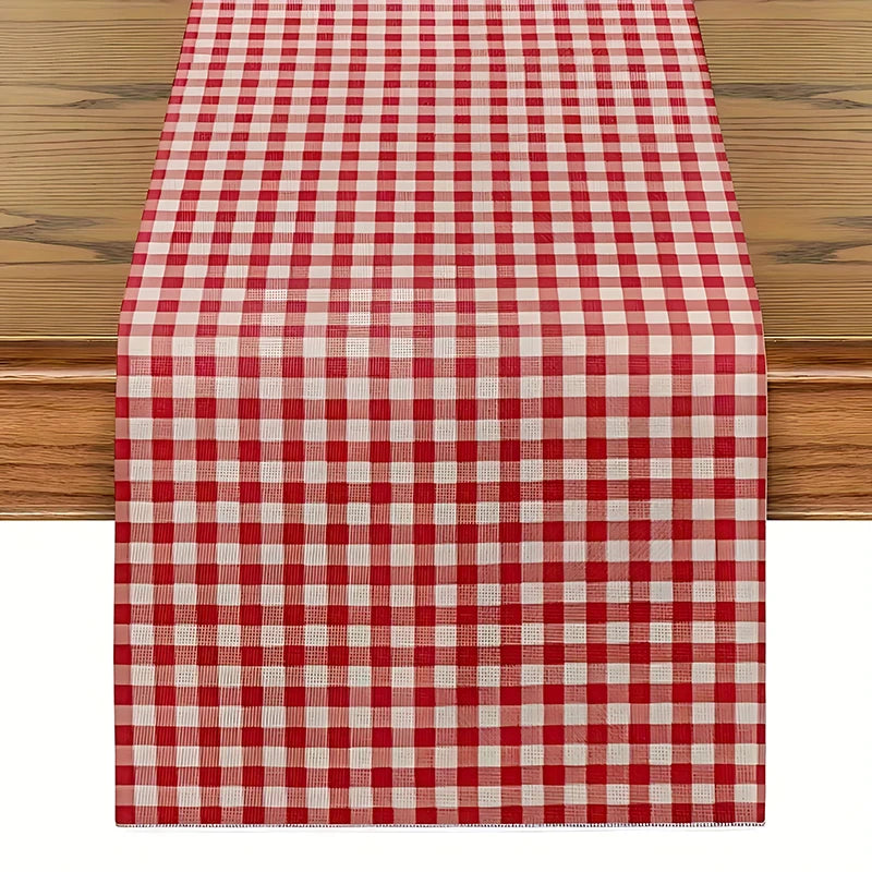 A red and white checkered table runner placed on a wooden table.