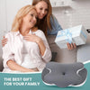 A woman is hugging another woman while holding an ergonomic memory foam neck pillow.