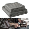 Stack of gray lint-free microfiber cleaning towels used for coffee machines and barista tasks