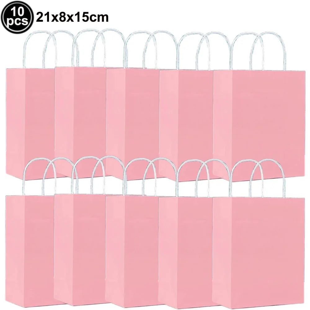 Ten pink paper gift bags with white handles stacked in a row